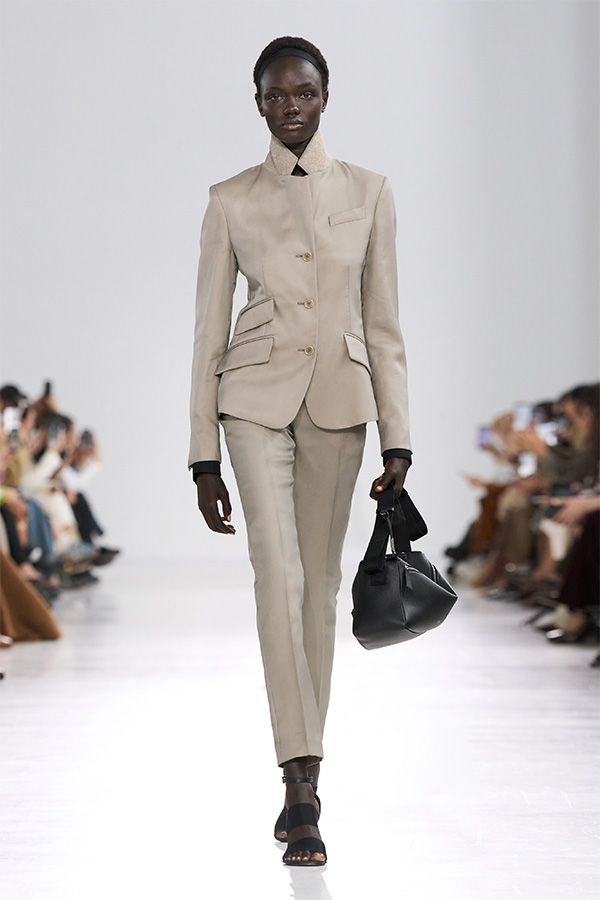 Max Mara Spring/Summer 2026 Fashion Show - Suit Look with jacket, tailored trousers and black bag.