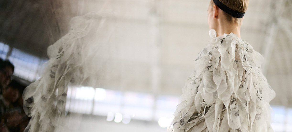 Max Mara Spring/Summer 2026 Fashion Show - Model from the shoulders with white dress.